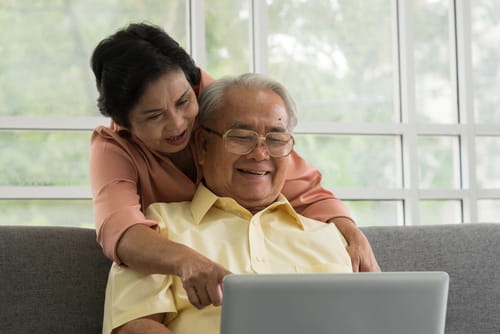 man and woman with computer