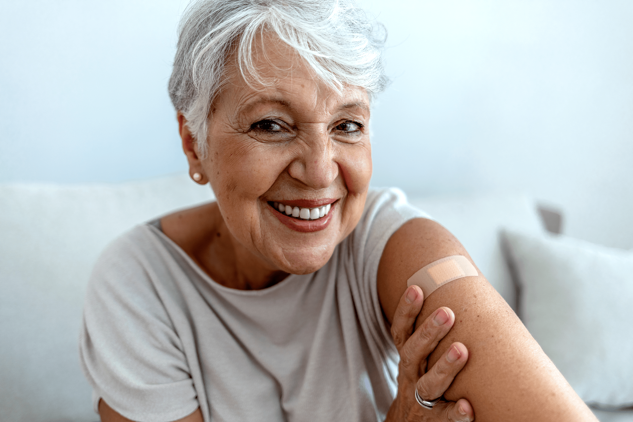 Smiling senior with bandaid