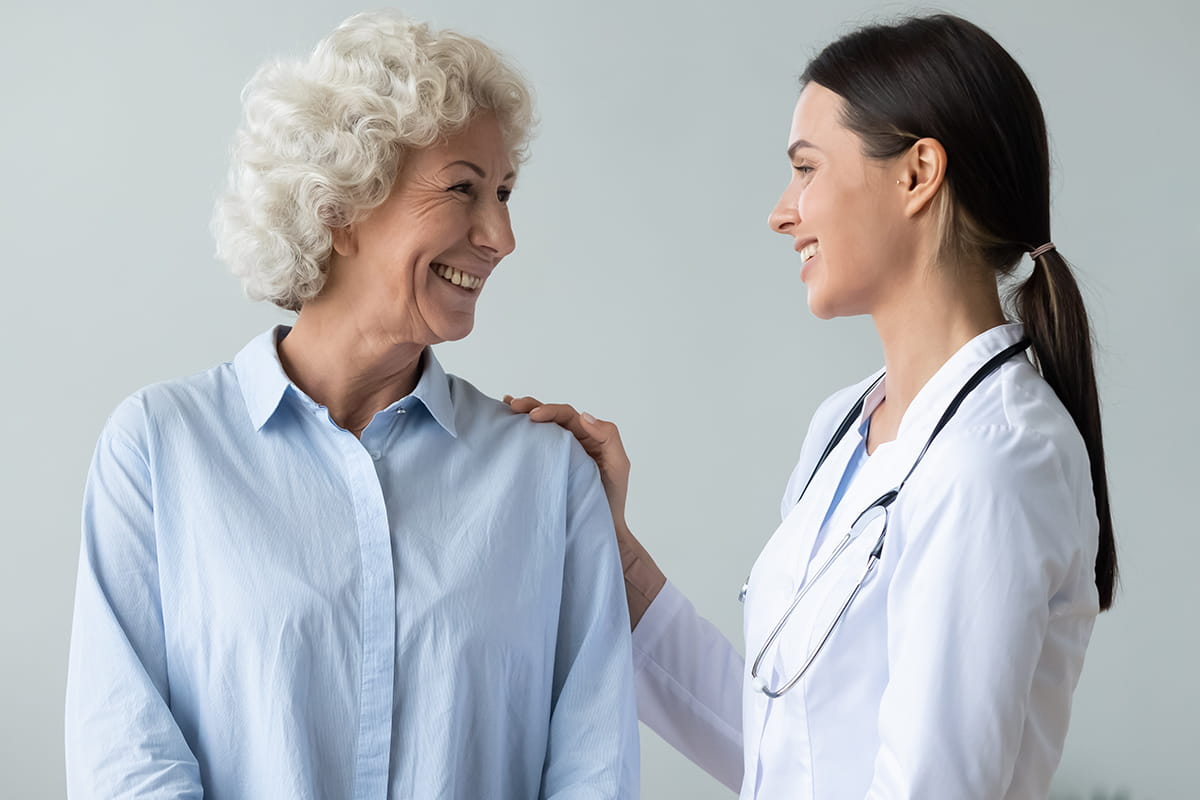 A senior woman visits her primary care physician.